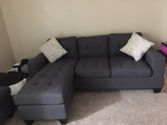 Brand new! In the box. Grey sectional with oversized ottoman