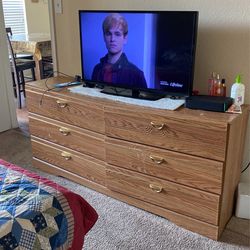 TV and six drawer dresser I will take $100 for a boat