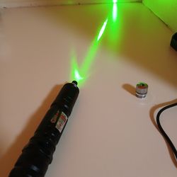 Green laser pointer with charger.