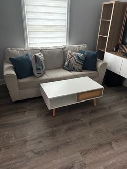 Sofa bed style living room set with coffee table