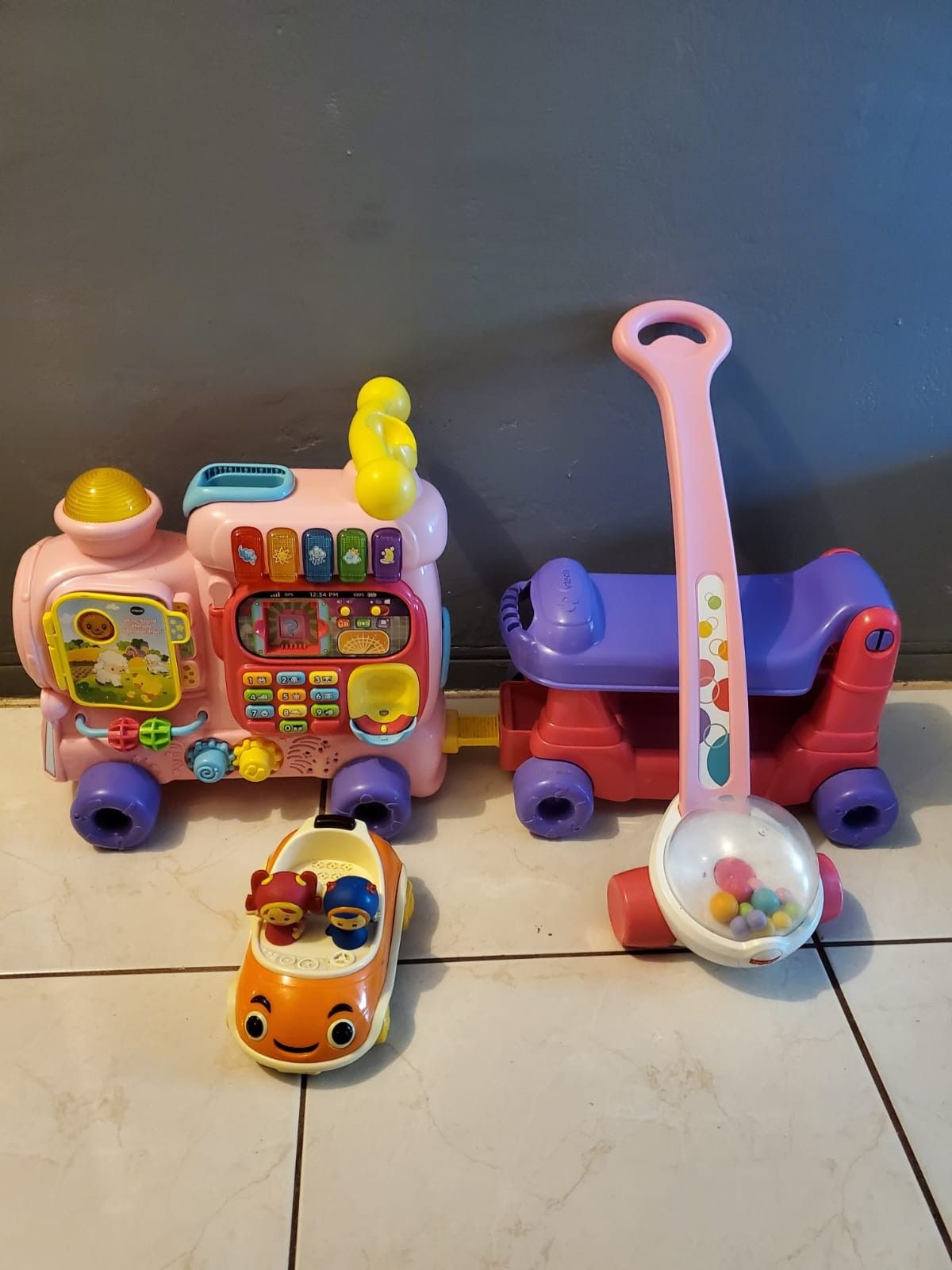 VTECH TRAIN, FISHER PRICE POPPER AND A TEAM UMISUMI CAR TOYS