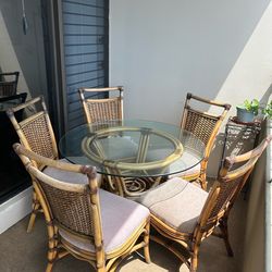 Rattan glass top table and 5 chairs by Veranda