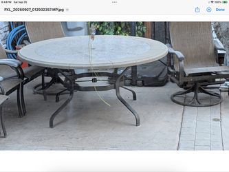 Stone table, 4 chairs and 2 rockers (seats 6)
