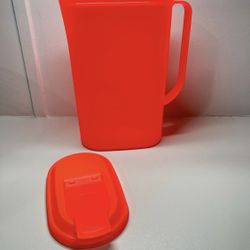 Tupperware pitcher in a reddish orange color