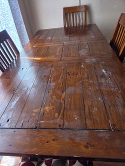 Wood table and 4 chairs with cushions