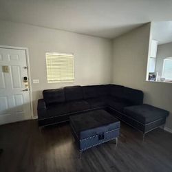 Black Sectional With Ottoman 