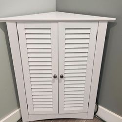 2 door white corner storage cabinet shutter doors adjustable shelf space saver