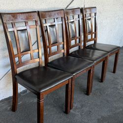 Set of 4 solid wooden dining chairs