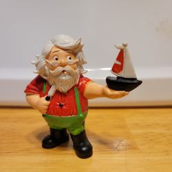 Santa Claus painting toy boat ornament