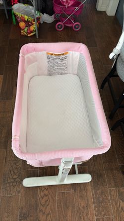 Pink baby bassinet