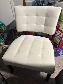 White faux leather tufted accent chair