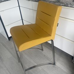 3  yellow bar stools