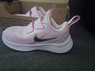 Pink baby nike shoes