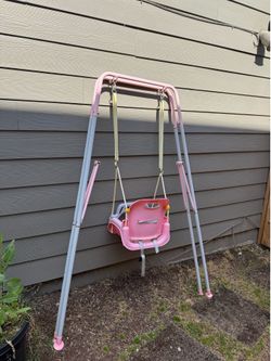 Pink baby swing