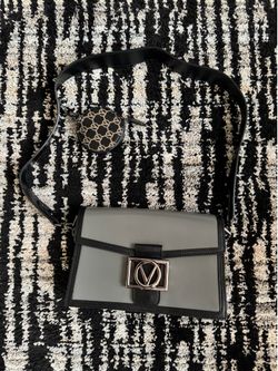 Valentino by Mario Valentino Mina V Emblem Leather Crossbody bag in gray and black.