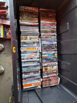 2 crates of DVD movies and 1 white box