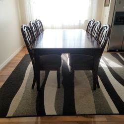 table and 8 chairs in good condition   $550