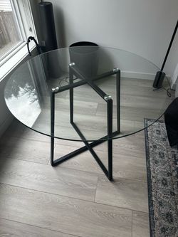 Round Glass Dining Table with Black Metal Base