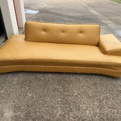 vintage 1950s "dog bone" style chaise lounge is featured in embossed gold vinyl.