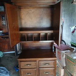 vintage wood armoire or secretary desk with two upper cabinet doors and six lower drawers
