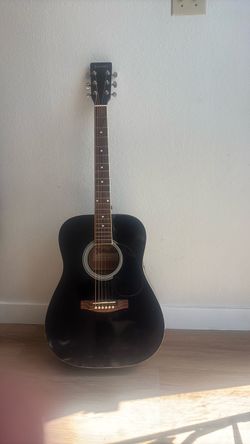 Black Estrella 6 String Acoustic Guitar.