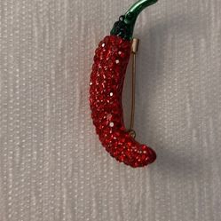 Red chili pepper design brooch.