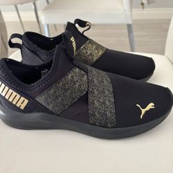 Puma black and gold sneakers