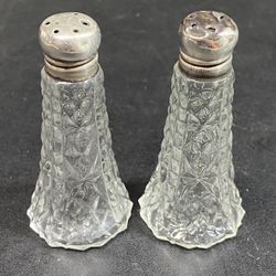 Crystal & sterling Silver Salt & Pepper Shakers 2.5” Tall X 1.25” Wide. No chips in Crystal. Damage to the top of one shaker as shown in photos. 