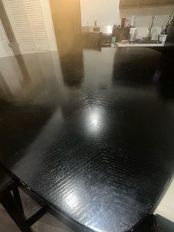 Black Triangular Counter Height Dining Set with 3 Swivel Stools
