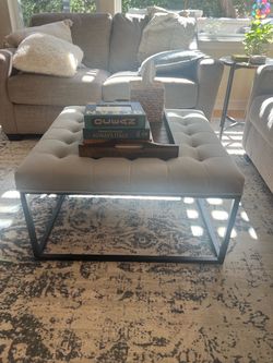 Grey suede ottoman coffee table