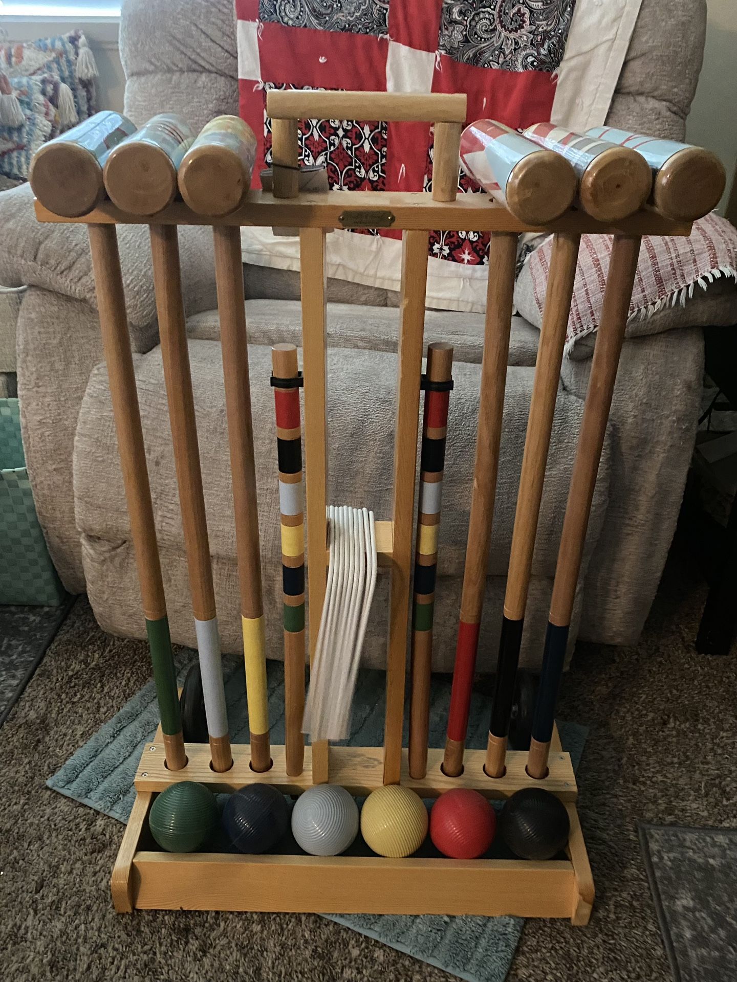 Wood croquet set, cart with wheels. no missing pieces only use a couple times, like new