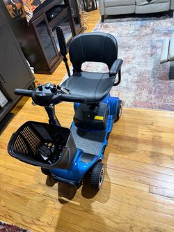 Never used New 4-Wheel Electric Mobility Scooter Blue