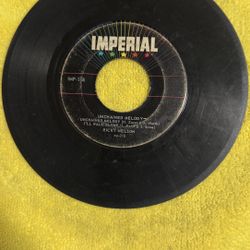 This item is a collectible vintage 7-inch vinyl record, specifically an Extended Play (EP) record by Ricky Nelson titled "Unchained Melody," released 