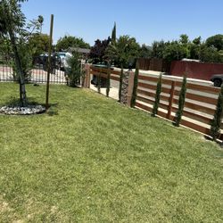 redwood and concrete columns fence 