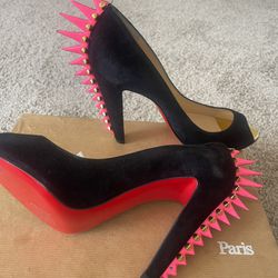 Christian Louboutin (Red bottoms )
