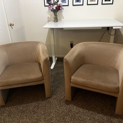 Two barrel accent chairs
