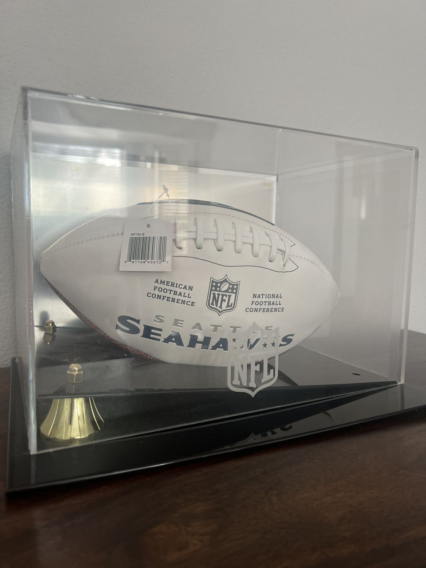 PSA authenticated leather football signed by NFL player Darryl Talley