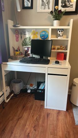 White desk for a smaller space. Spacious drawers and shelves with dry erase backboard.