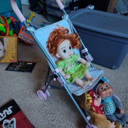 Stroller & 3 Dolls