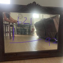 mirror in antique carved wooden frame