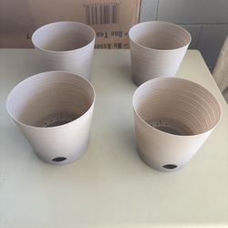 4 Small Plastic Planters