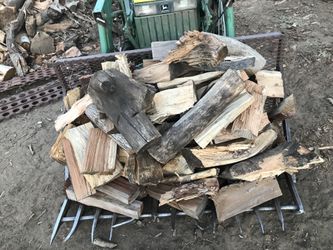 Tractor bucket of firewood