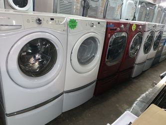 Front loading washer and electric dryer with pedestals in excellent conditions with 4 months warranty