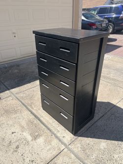 Tall black wood dresser