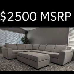 Large Beige Sectional by Living Spaces with Ottoman. 