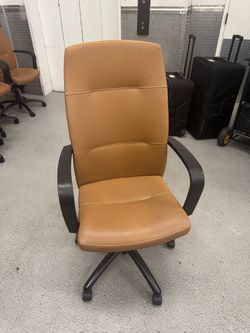 Brown Gunlocke leather conference chair