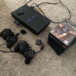 PS2 with 2 Controllers and Games 