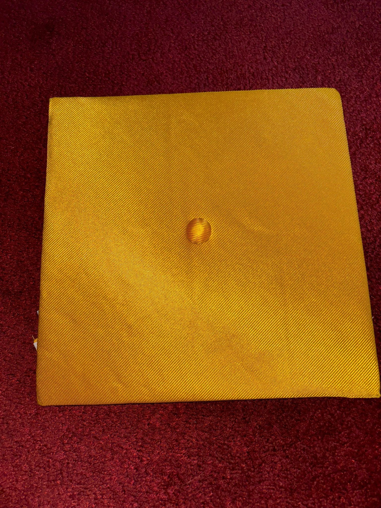 Gold Graduation Cap • Description: Square-top gold graduation cap with an elasticized fit.
