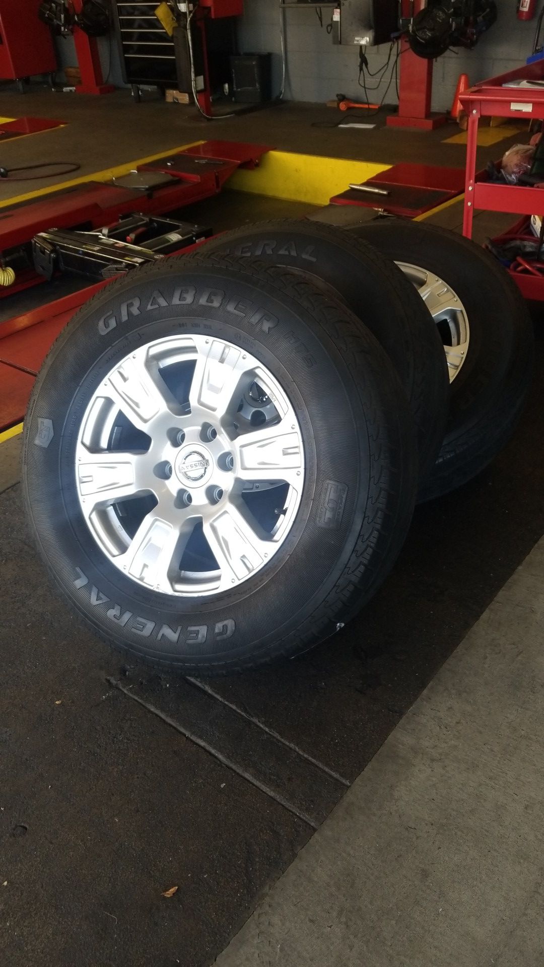 A set of Nissan Titan Rims w/tires 265/70R18