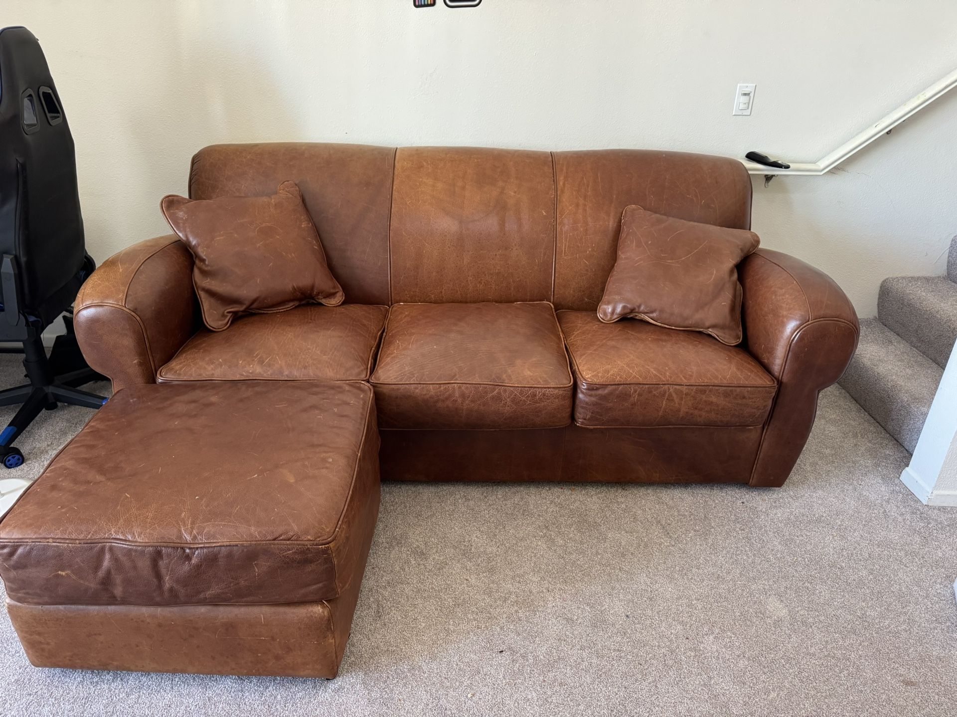 leather sofa with a matching ottoman